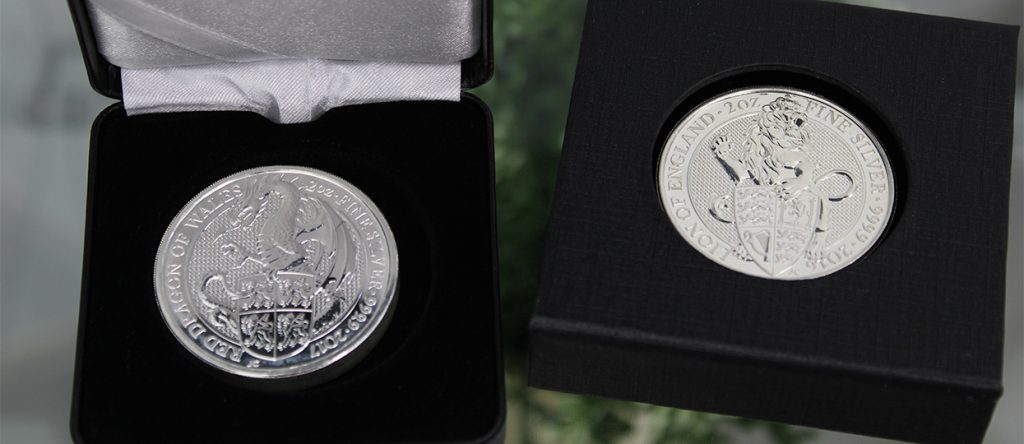 Estanterías con monedas de plata Dragón Rojo de Gales y León de Inglaterra de 2oz