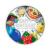 Perspectiva frontal de la cruz de la moneda de plata policromada Feliz Cumpleaños de 1oz de 2024, que muestra globos, regalos y platos típicos de esta celebración