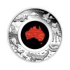 moneda-gran-tierra-del-sur-plata-policromada-1oz-2025 Perspectiva frontal de la moneda de plata policromada Gran Tierra del Sur de 1oz de 2025, que muestra lel continente australiano en rojo rodeado de su principal fauna.
