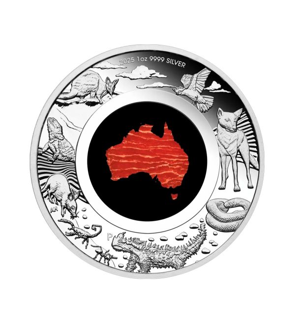 moneda-gran-tierra-del-sur-plata-policromada-1oz-2025 Perspectiva frontal de la moneda de plata policromada Gran Tierra del Sur de 1oz de 2025, que muestra lel continente australiano en rojo rodeado de su principal fauna.